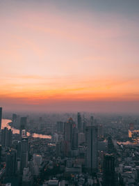 Cityscape against sky during sunset