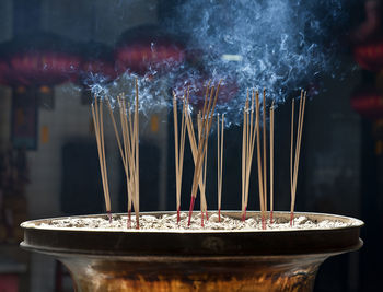 Close-up of incense in temple