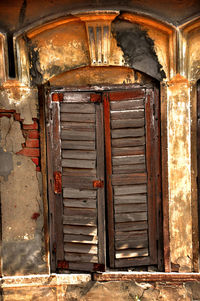 Closed door of old abandoned building