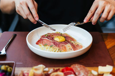 Midsection of man having food