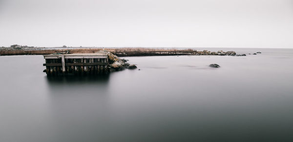 Panoramic view of lake against clear sky