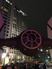 Low angle view of illuminated building at night