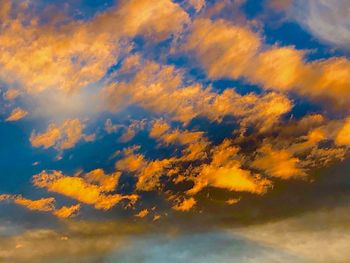 Low angle view of dramatic sky during sunset