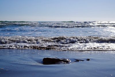 Scenic view of sea against clear sky