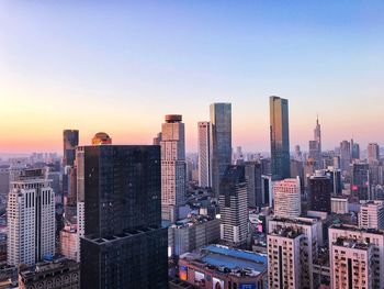 Aerial view of city at sunset