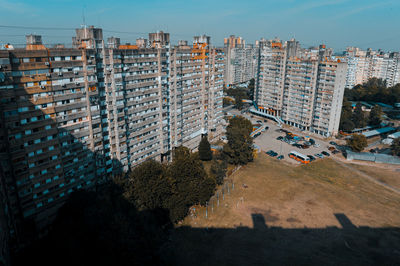 High angle view of buildings in city against sky