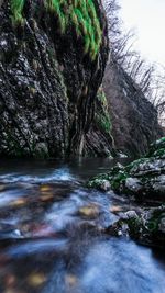 Scenic view of waterfall against sky