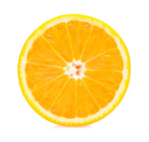 Close-up of orange slice against white background