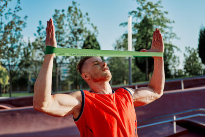 Rear view of woman exercising in gym