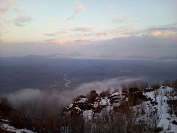 Scenic view of mountains against sky during winter