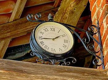 Close-up of clock on wood