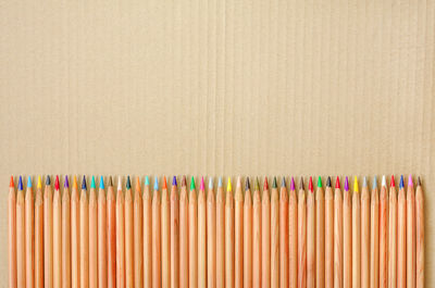 Close-up of colored pencils against white background