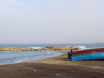 Scenic view of beach against clear sky