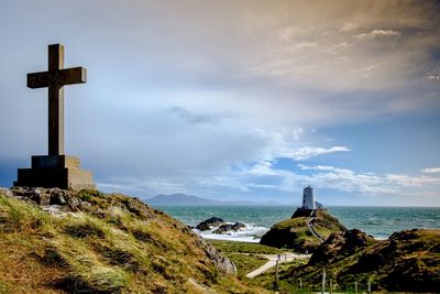 Scenic view of sea by building against sky