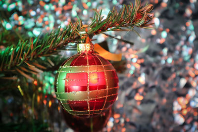 Close-up of christmas decorations hanging on tree