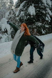Portrait of young woman in snow