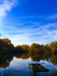 Scenic view of lake against sky during autumn