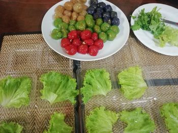 High angle view of fruits in plate on table