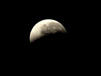 Low angle view of moon against clear sky at night