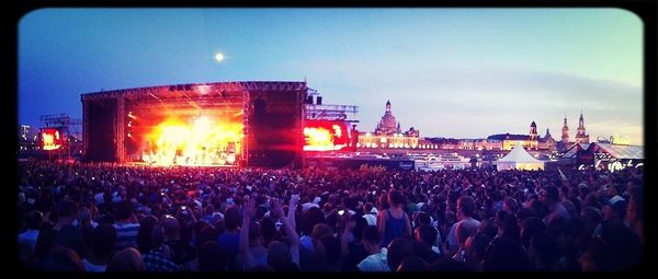 People enjoying music concert at night