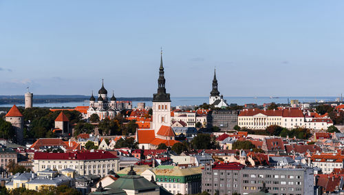 View of buildings in city against sky