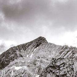 Low angle view of mountain range against sky