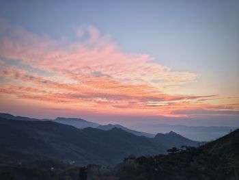 Scenic view of silhouette mountains against sky during sunset