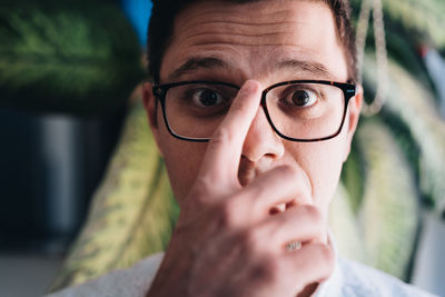 Portrait of young man wearing eyeglasses