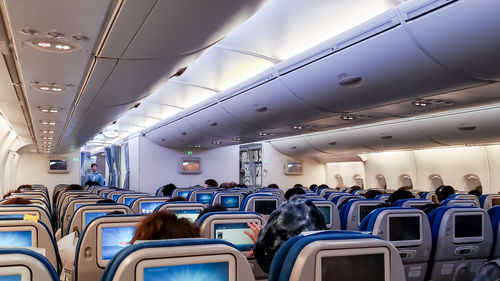 Low angle view of people in train
