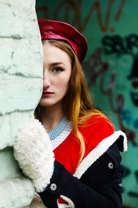 Portrait of young woman wearing hat