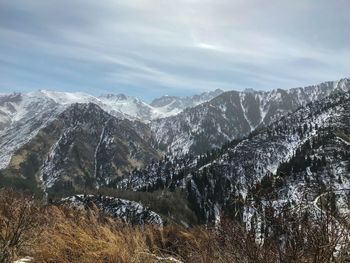 Scenic view of snowcapped mountains against sky