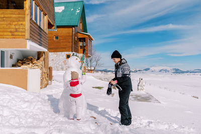 Portrait of woman skiing on snow