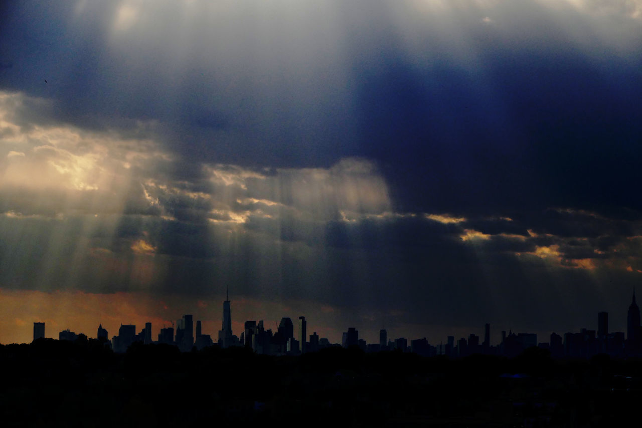 SILHOUETTE CITYSCAPE AGAINST SKY DURING SUNSET