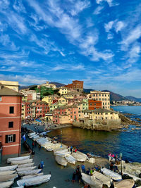 Buildings by the sea against the sky.