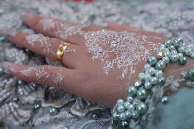 Close-up of woman hand with umbrella