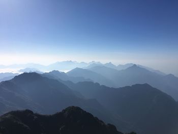 Scenic view of mountains against clear blue sky