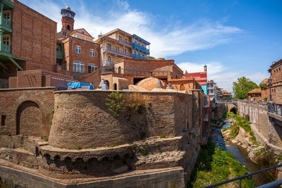 Old building in city against sky