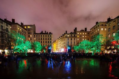 Illuminated buildings in city at night