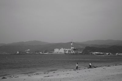 Scenic view of beach against clear sky