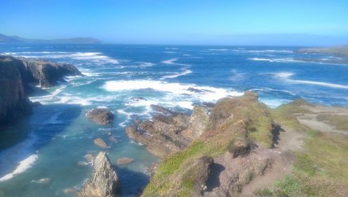 High angle view of rocks on beach against sky