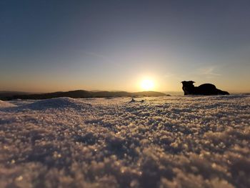 Scenic view of silhouette land against sky during sunset