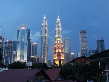 Modern buildings in city against sky