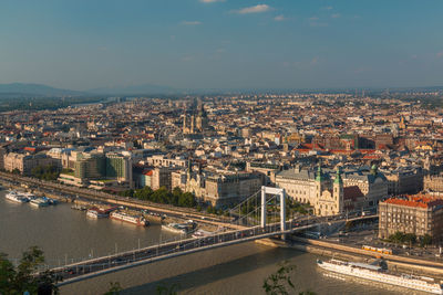 High angle view of bridge over river amidst buildings in city