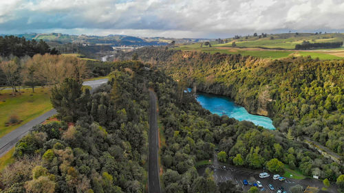 High angle view of river amidst landscape against sky