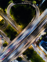 High angle view of light trails on road in city