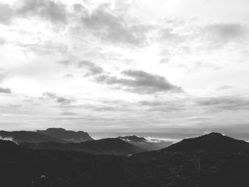 Scenic view of silhouette mountains against sky