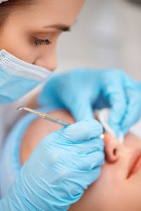 Close-up of doctor injecting syringe