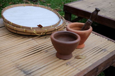 High angle view of mortar and pestle on table