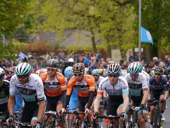 People riding bicycles on road