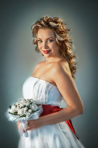 Portrait of a beautiful young woman over white background